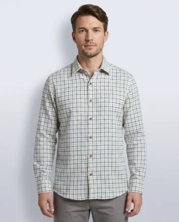 Cobalt Grid Shirt, a handwoven khadi check shirt worn untucked, front view showing the two-weight blue grid, point collar and coconut-shell buttons