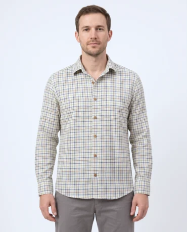 Handwoven khadi cotton shirt in a blue and green tattersall check on cream, worn untucked, front view with coconut-shell buttons