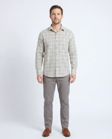 Man wearing a handwoven khadi cotton shirt in a blue and green check on cream, full-length front view